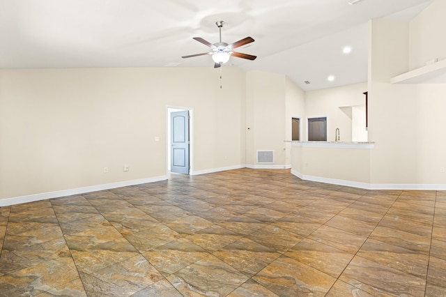 unfurnished living room featuring ceiling fan, sink, and high vaulted ceiling