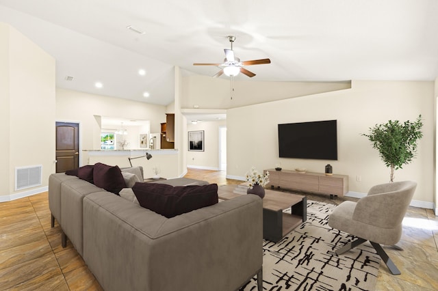 living room with ceiling fan and lofted ceiling