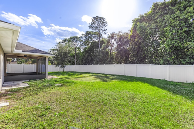 view of yard featuring ceiling fan