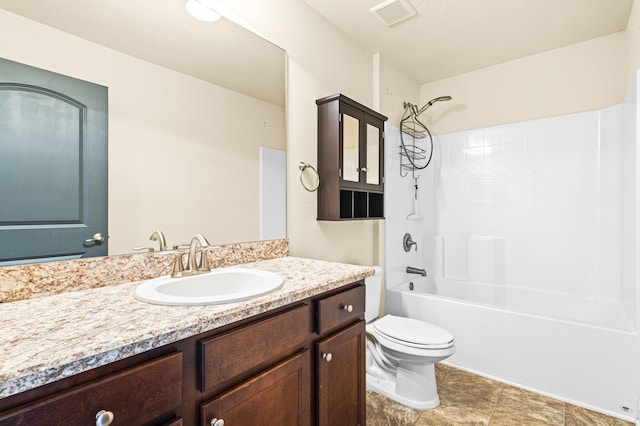 full bathroom featuring vanity, toilet, and  shower combination