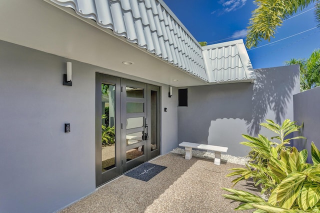 entrance to property featuring french doors