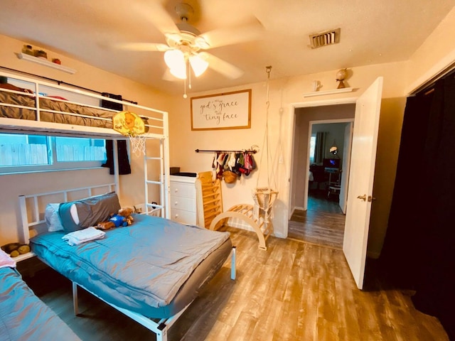 bedroom featuring hardwood / wood-style flooring and ceiling fan