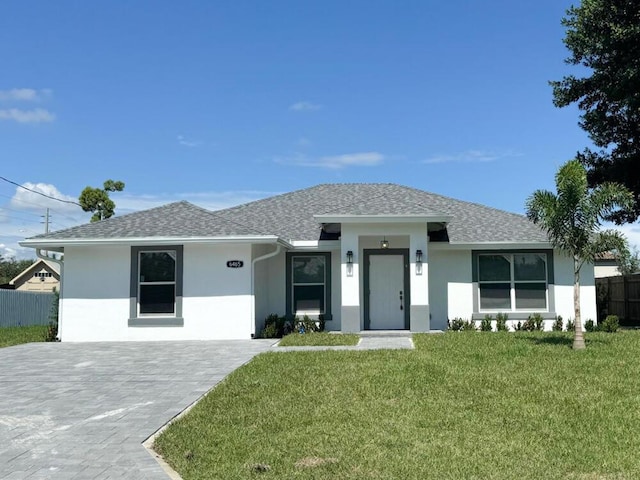 view of front of home with a front lawn