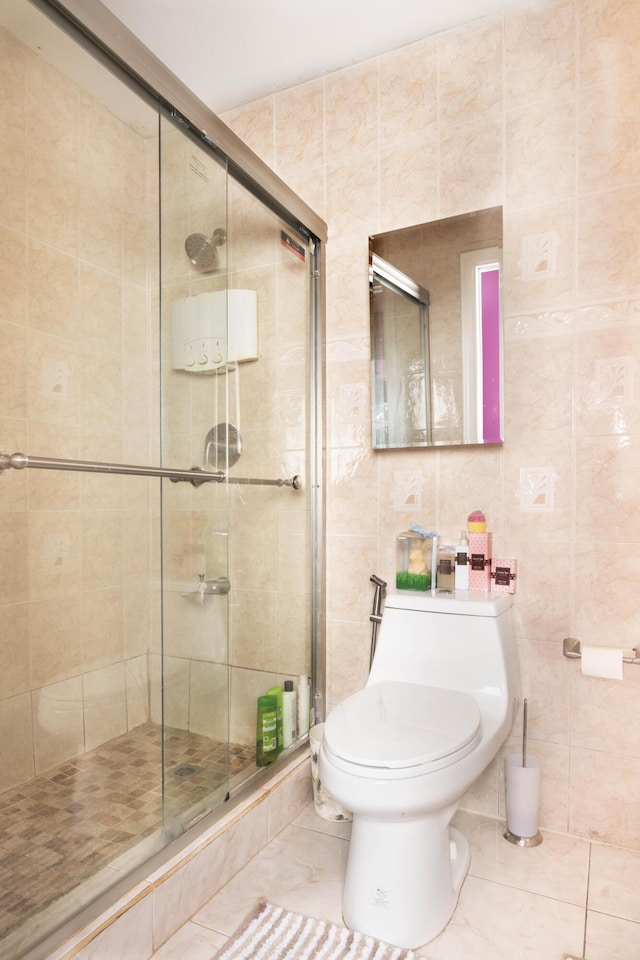 bathroom featuring an enclosed shower, tile patterned flooring, toilet, and tile walls