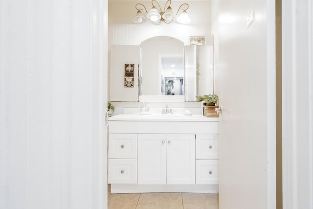 bathroom featuring tile patterned flooring and vanity