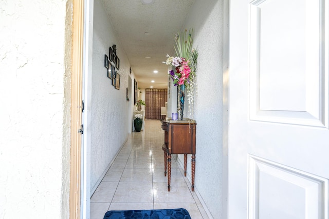 hallway featuring light tile patterned floors