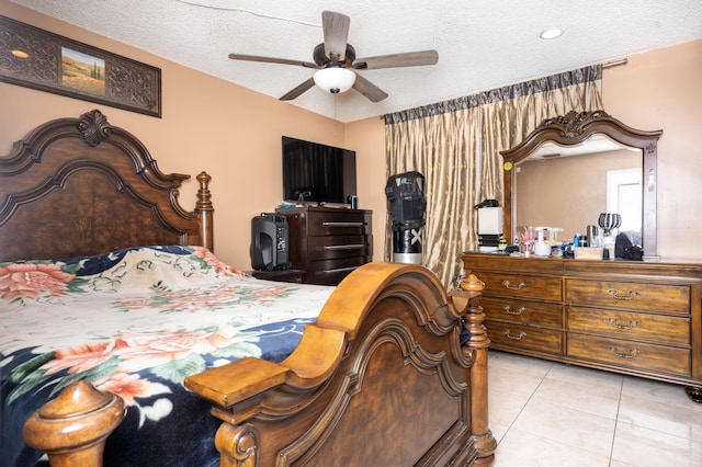 tiled bedroom featuring ceiling fan and a textured ceiling