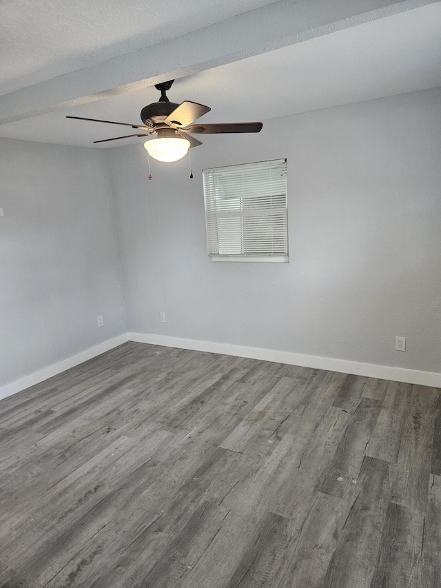 empty room featuring ceiling fan and hardwood / wood-style floors