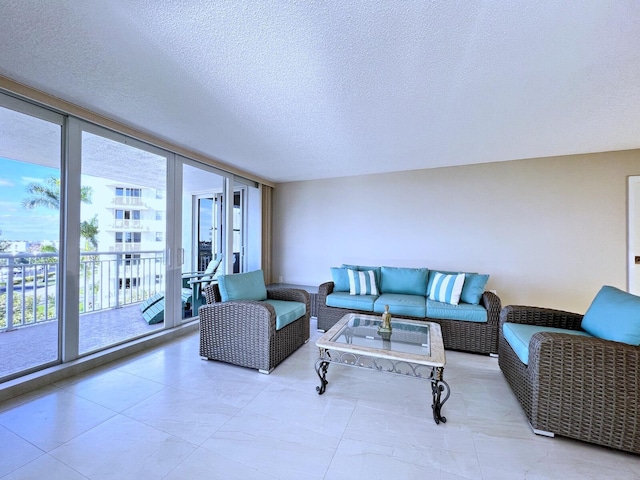 living room with a healthy amount of sunlight and a textured ceiling