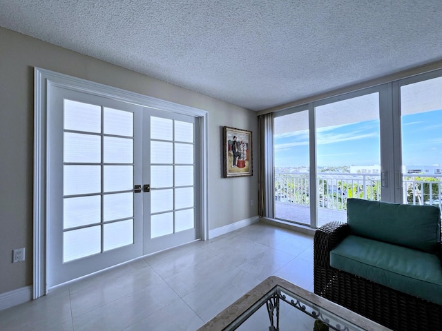 interior space with tile patterned floors and a textured ceiling