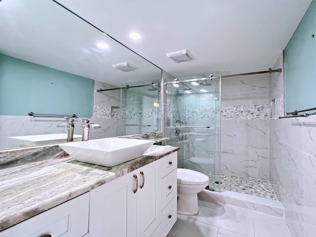 bathroom featuring walk in shower, vanity, and toilet