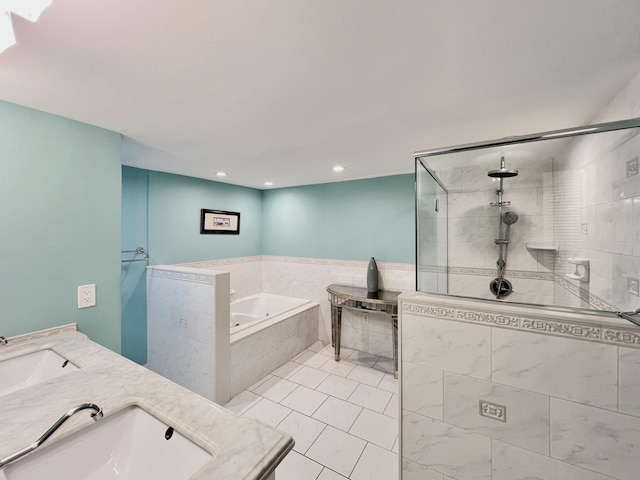 bathroom featuring tile patterned flooring, shower with separate bathtub, and vanity