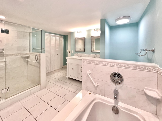 bathroom with tile patterned flooring, vanity, and separate shower and tub