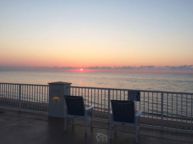 patio terrace at dusk with a water view