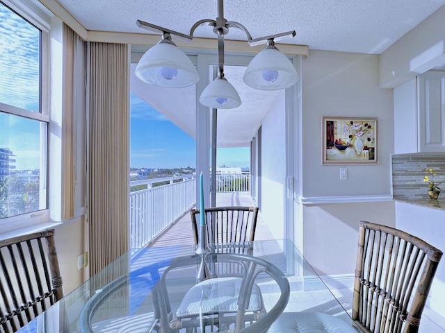 dining area with a textured ceiling