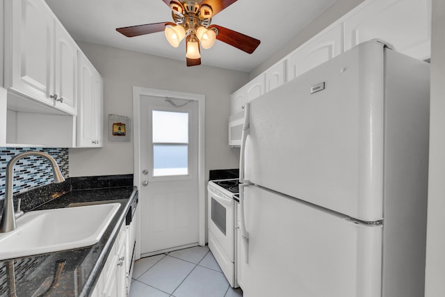 kitchen featuring white cabinetry, ceiling fan, tasteful backsplash, white appliances, and sink