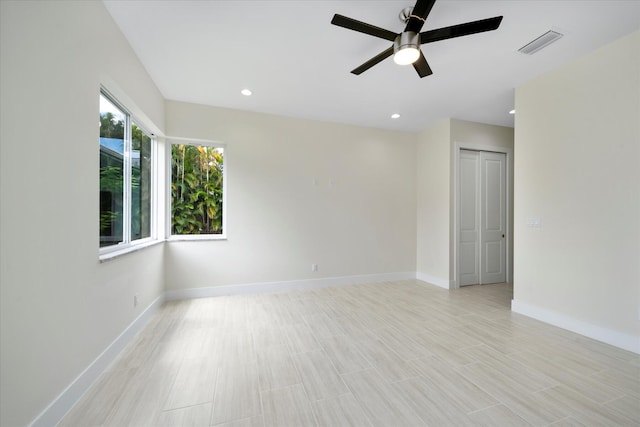 spare room with ceiling fan