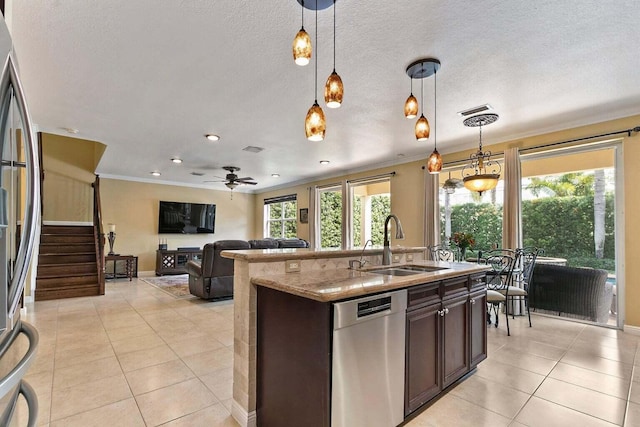 kitchen with appliances with stainless steel finishes, light stone counters, ceiling fan, sink, and pendant lighting