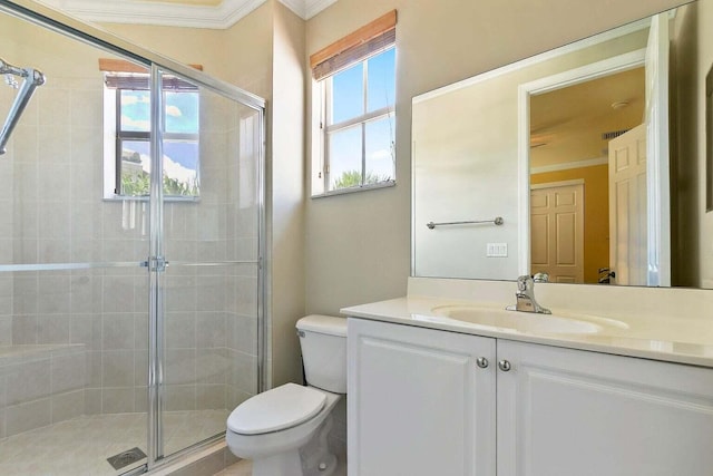 bathroom with vanity, toilet, an enclosed shower, and crown molding