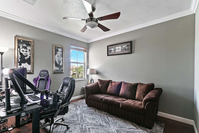 office featuring ceiling fan, ornamental molding, a textured ceiling, and dark wood-type flooring