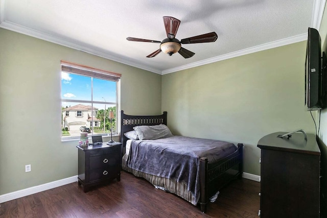 bedroom with a textured ceiling, ceiling fan, ornamental molding, and dark wood-type flooring