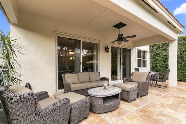 view of patio / terrace with an outdoor living space and ceiling fan