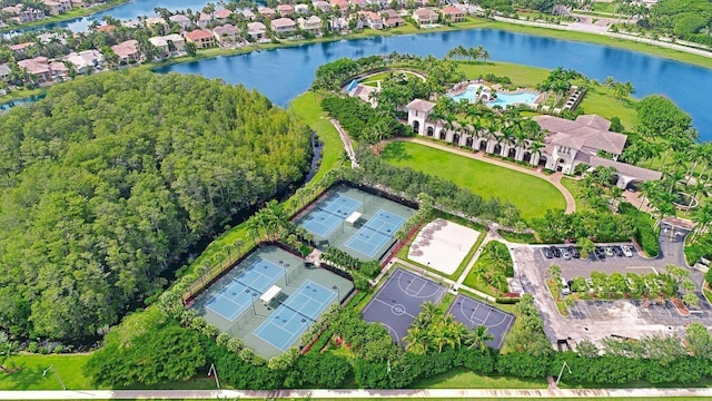 birds eye view of property with a water view