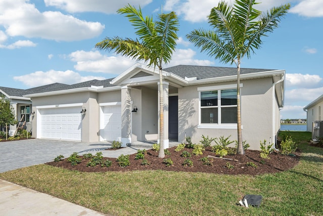 view of front of home featuring a garage and a front yard