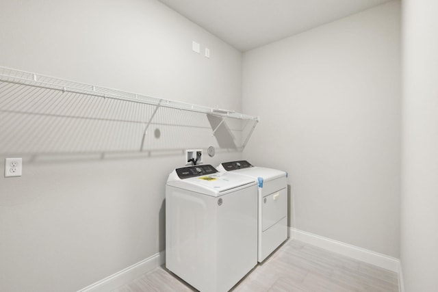 washroom featuring washer and clothes dryer