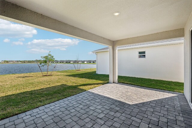 view of patio featuring a water view