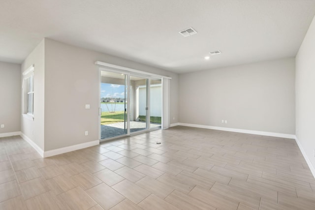 spare room with light wood-type flooring