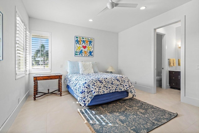 bedroom with tile patterned floors, connected bathroom, and ceiling fan