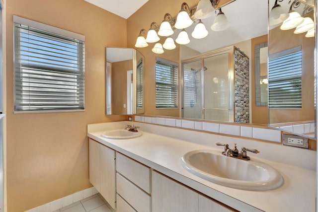 18 Amherst Ct Unit B, Royal Palm Beach, FL 33411 - full bathroom featuring a stall shower, double vanity, tile patterned floors, and baseboards