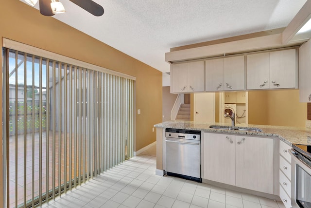 18 Amherst Ct Unit B, Royal Palm Beach, FL 33411 - kitchen with a sink, a ceiling fan, stainless steel appliances, light tile patterned floors, and a textured ceiling