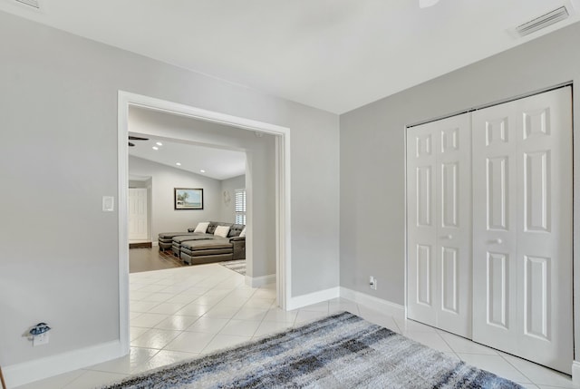 interior space with a closet and lofted ceiling