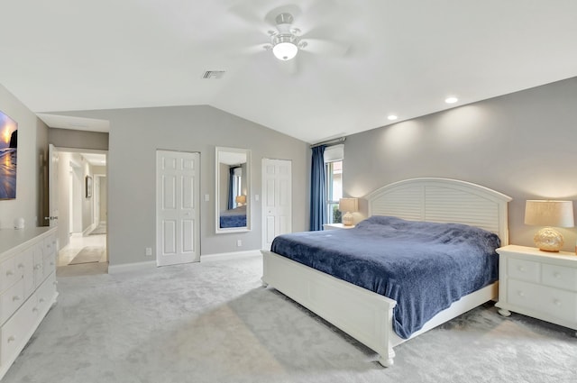 bedroom featuring ceiling fan, light colored carpet, and lofted ceiling