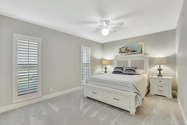 bedroom with light carpet and ceiling fan