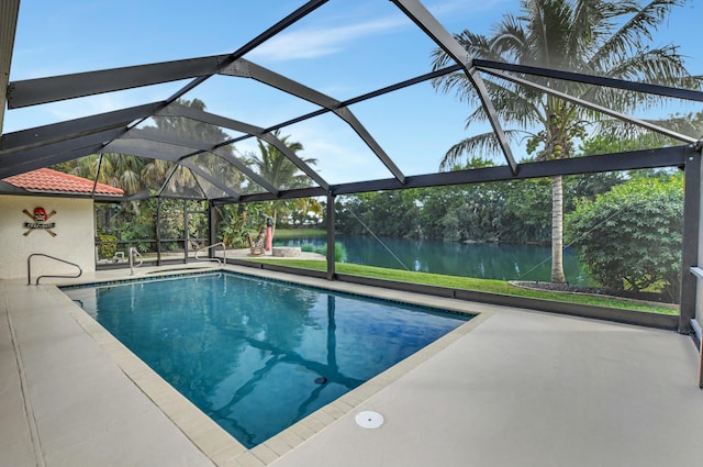 view of pool with a water view, a patio area, and a lanai