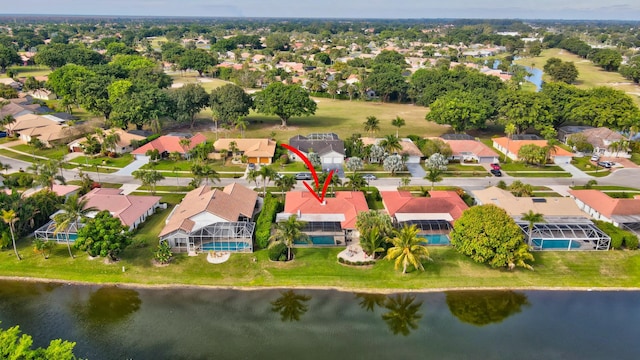 birds eye view of property featuring a water view