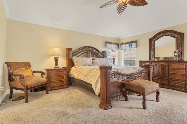 bedroom featuring crown molding, ceiling fan, and light carpet