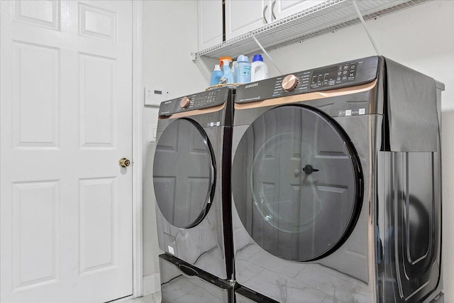 laundry area featuring washing machine and clothes dryer