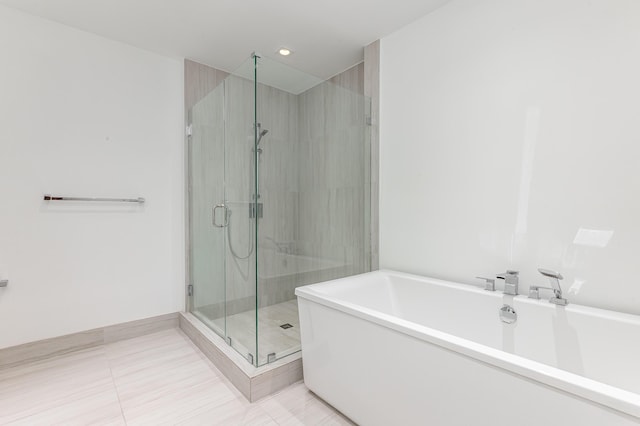 bathroom featuring tile patterned flooring and plus walk in shower