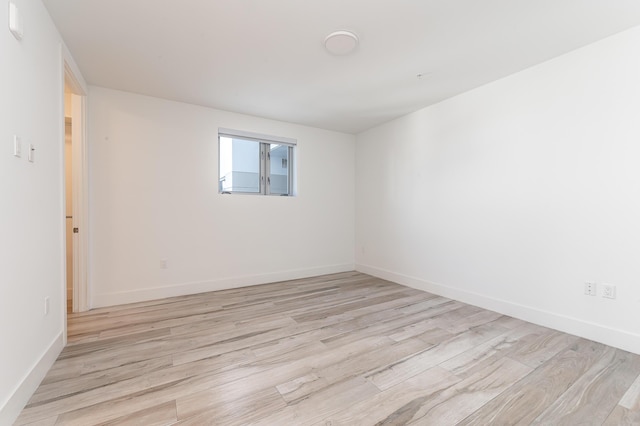 unfurnished room featuring light wood-type flooring