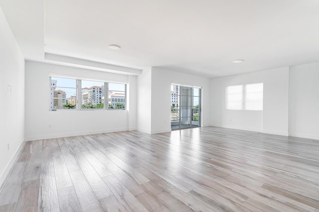 spare room featuring light hardwood / wood-style flooring