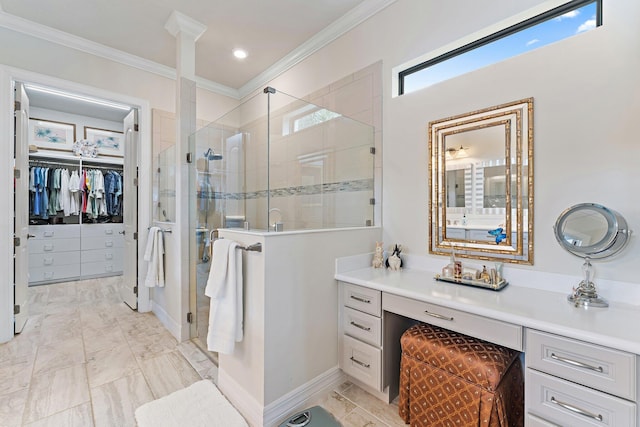 bathroom with vanity, crown molding, and a shower with shower door