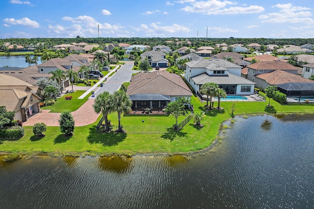 birds eye view of property with a water view