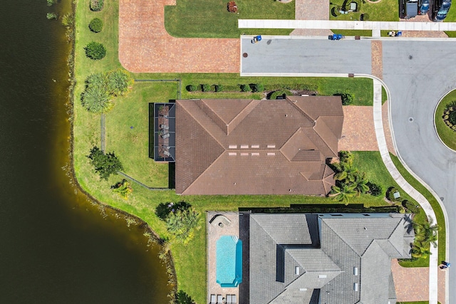 birds eye view of property with a water view