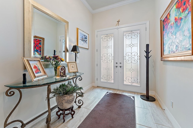 tiled foyer entrance featuring french doors and crown molding