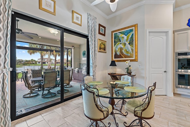 dining room with ceiling fan and ornamental molding