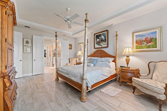 bedroom with ceiling fan, crown molding, and a tray ceiling